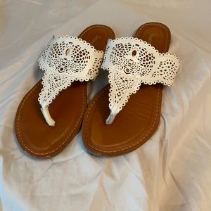 Cream colored flip flops